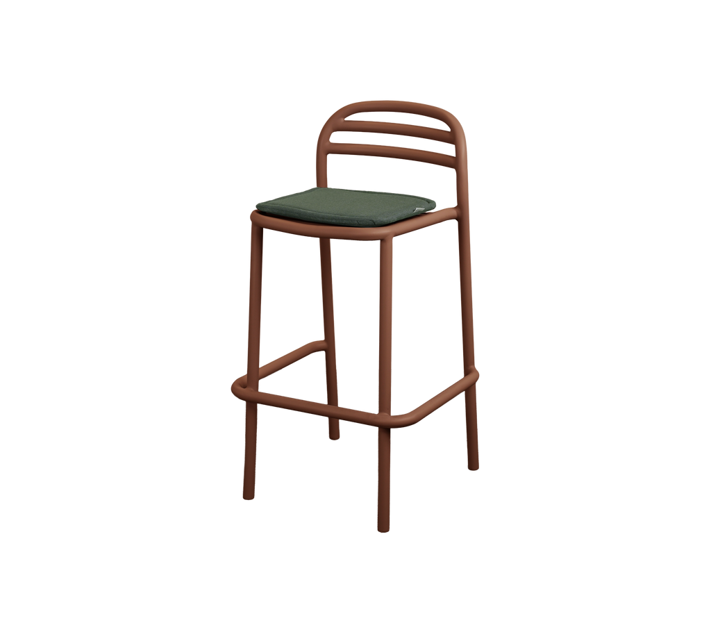 Modern bar stool with light green cushion and desert red frame.