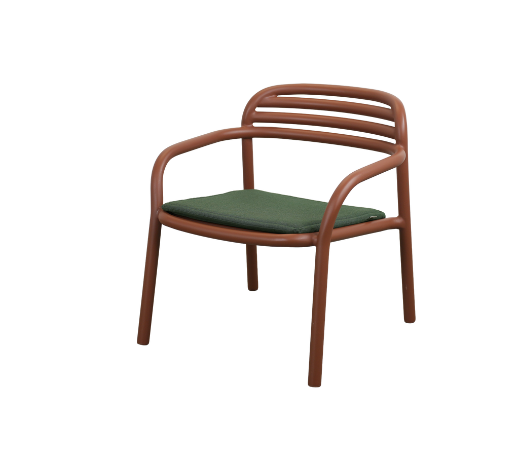 Modern chair with a green cushion and desert red frame.