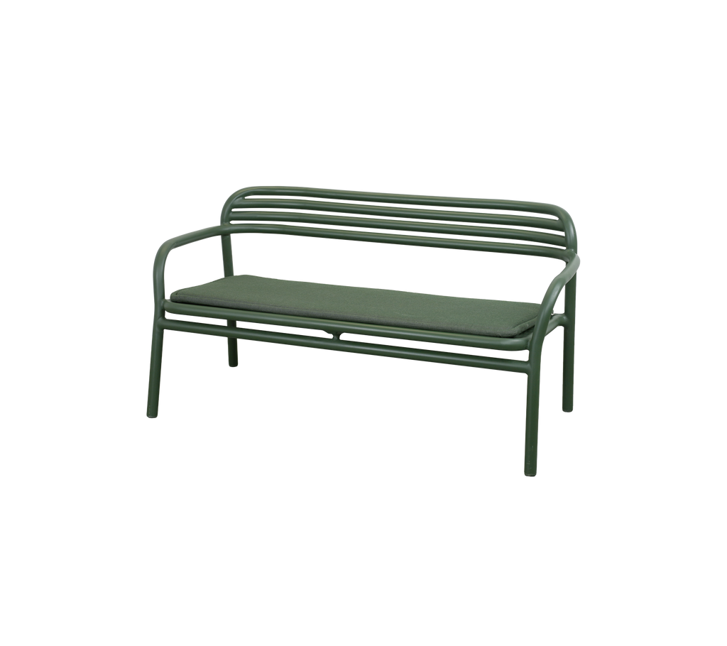 Dark green bench with light green cushion in a modern lounge setting.