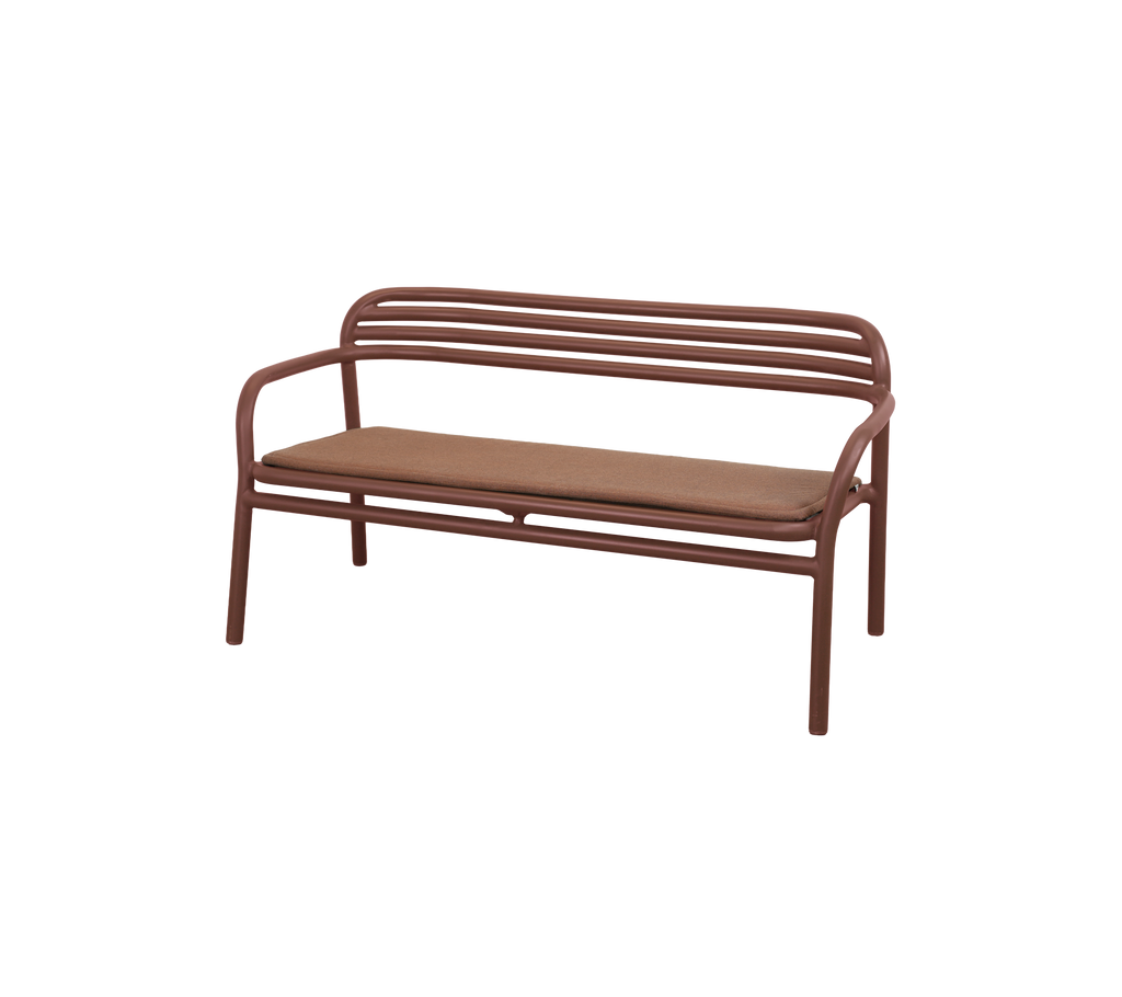 Desert red bench with a simple design and a padded seat.