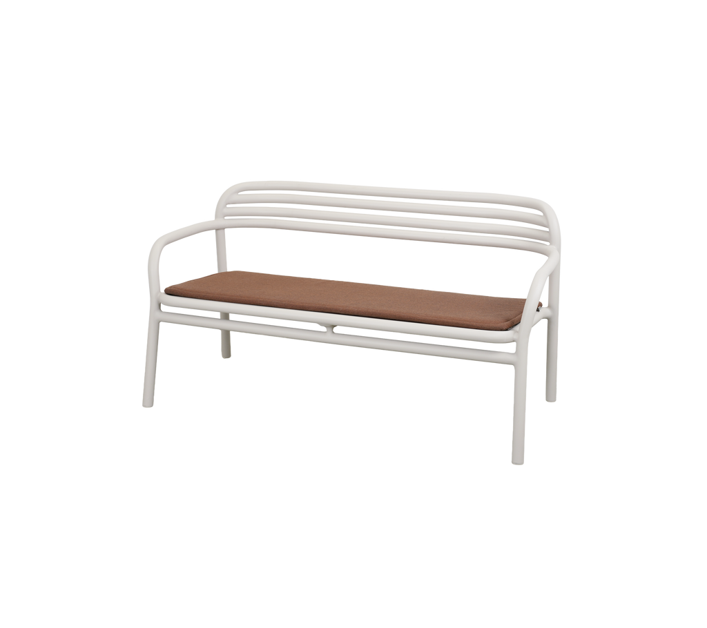A bench with a brown cushion.