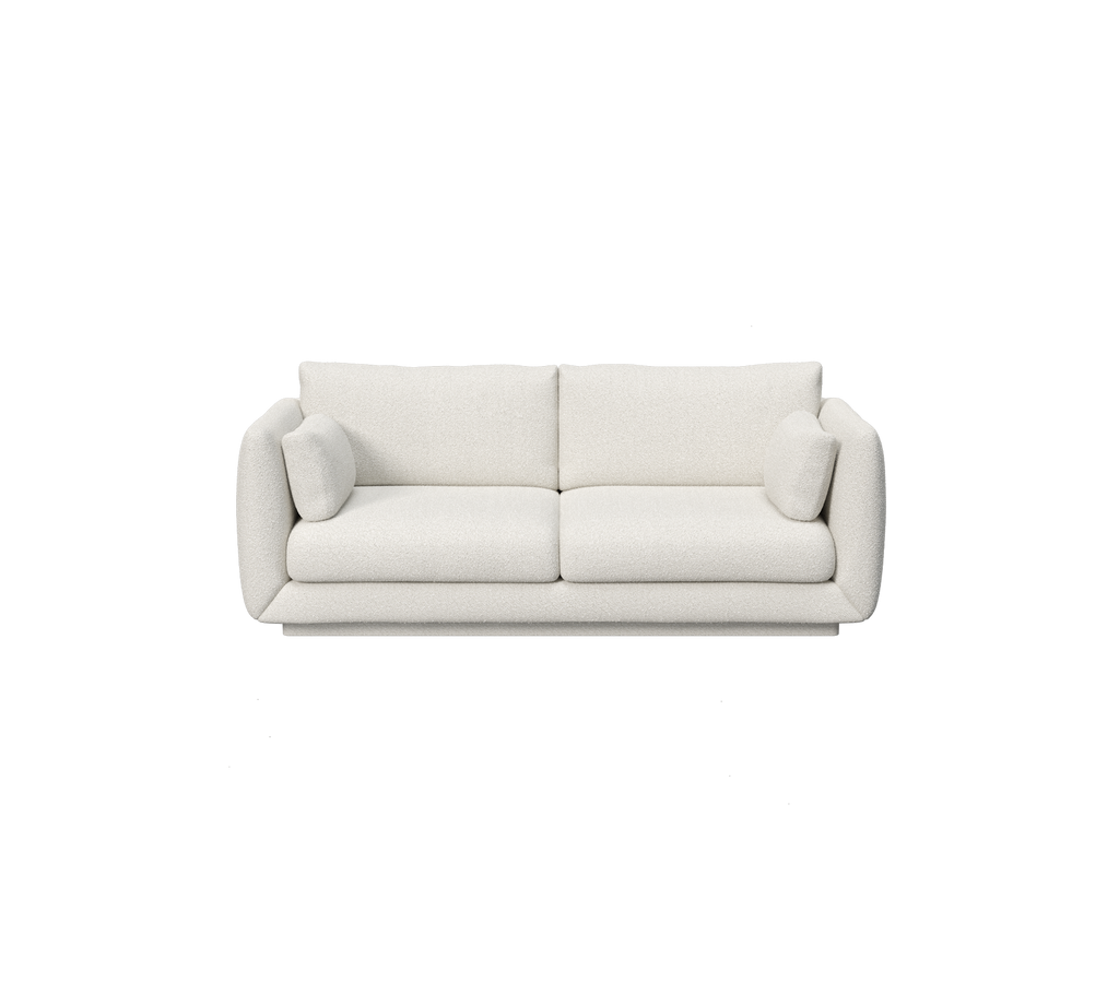 White modern minimalist sofa with rounded arms and plush cushions.