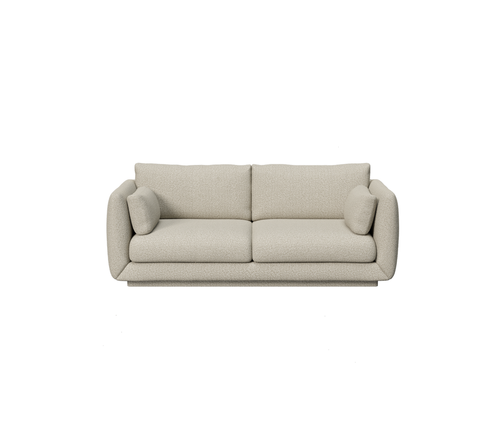 Light brown sofa with rounded cushions in a modern design.