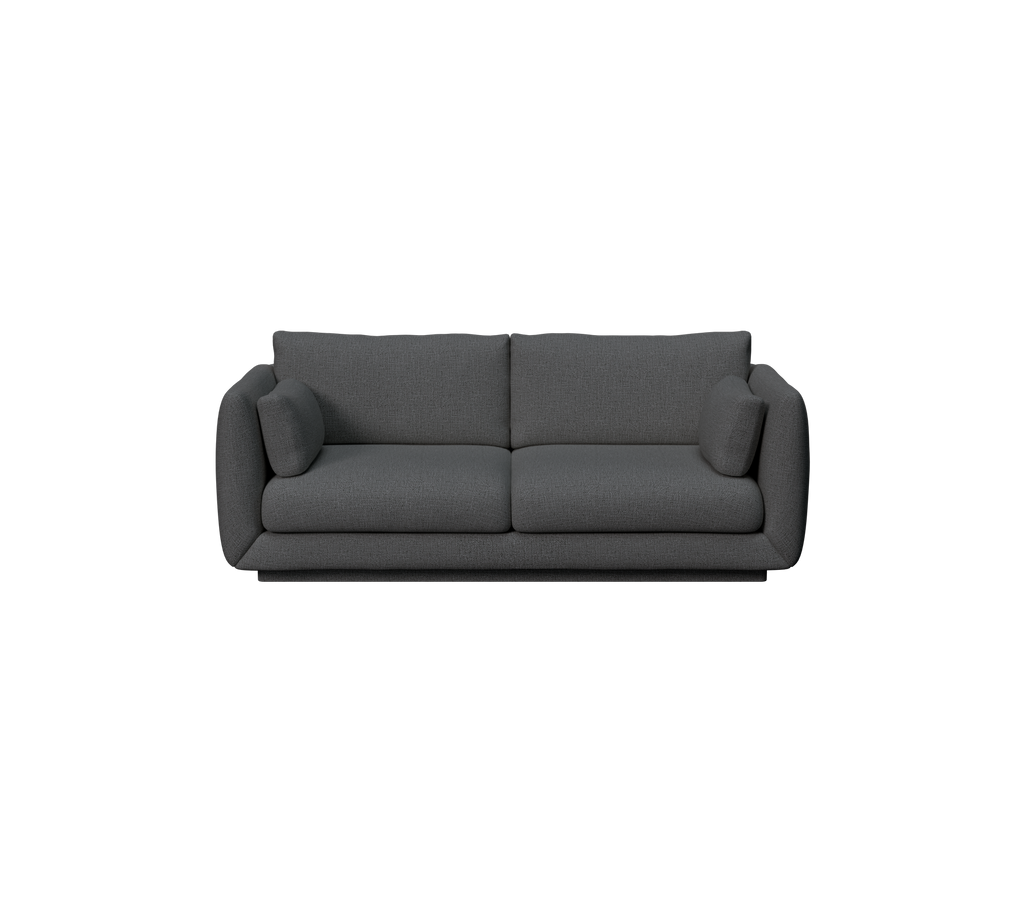 Modern dark green sofa with cushions.