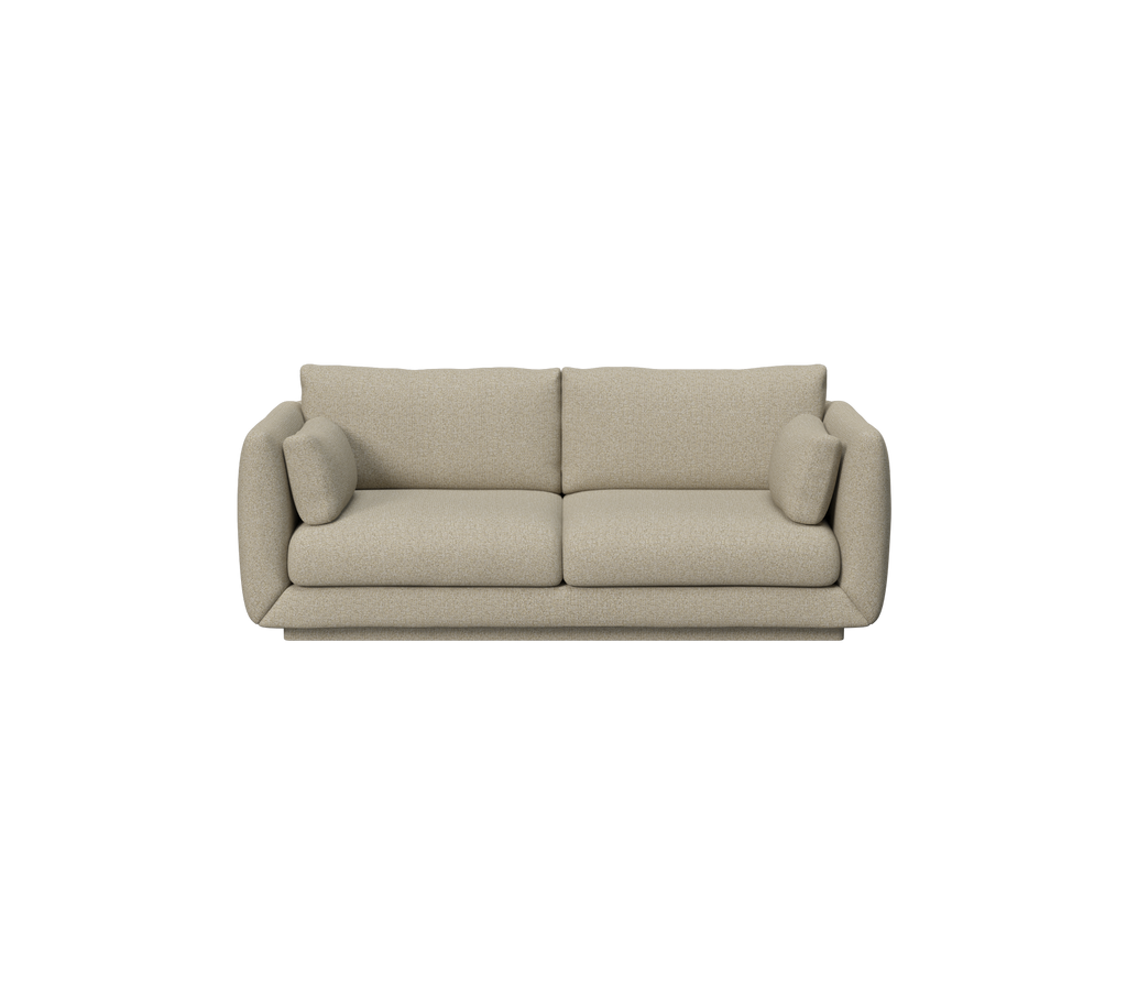Brown sofa with plush cushions in a modern lounge setting.