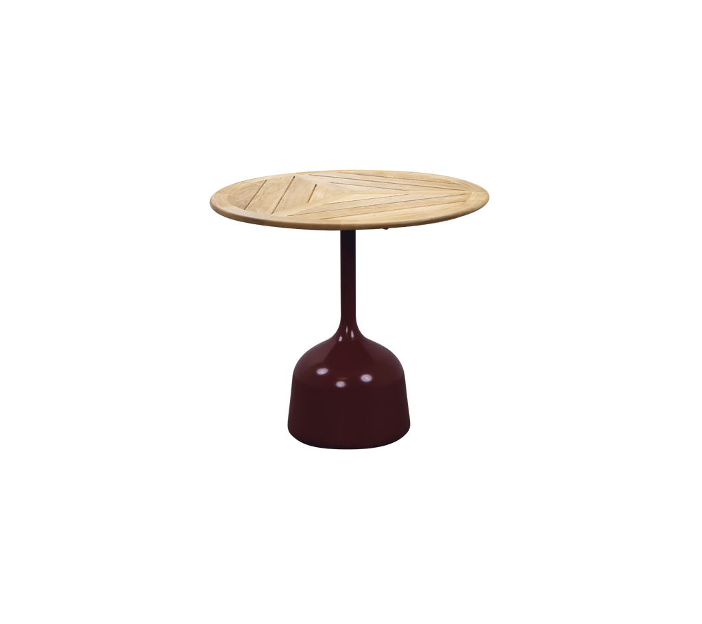 Burgundy table with a round teak top featuring a slatted design.