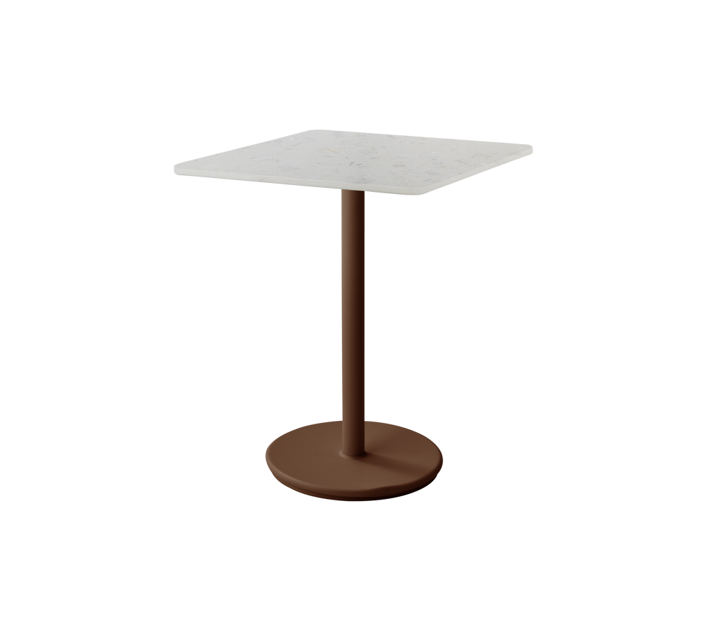 Square table with a desert red base and white top.