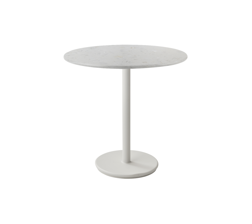 Modern round white table with a minimalist design.