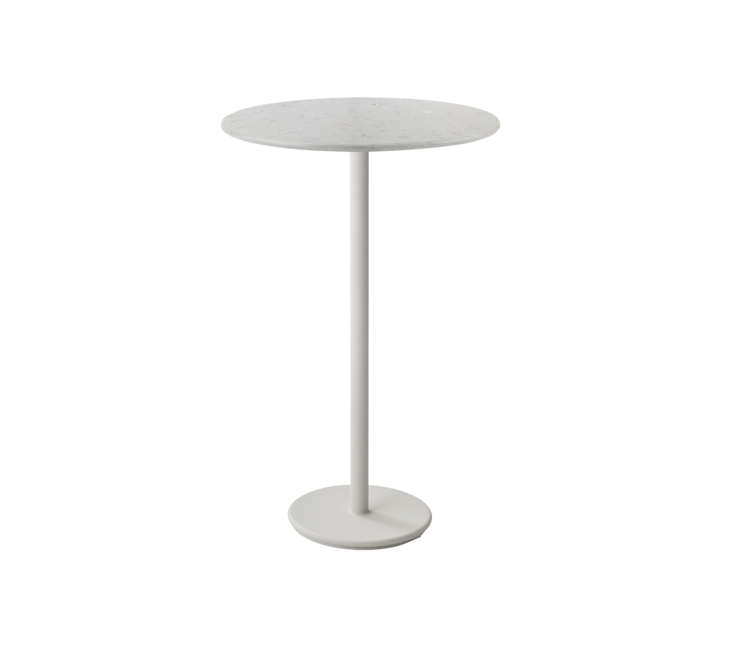 White round table with a thin base.