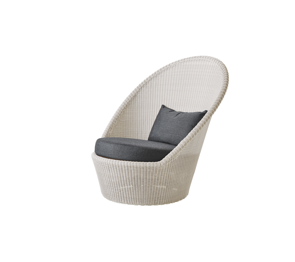 Modern sand chair with black cushion in a stylish lounge setting.