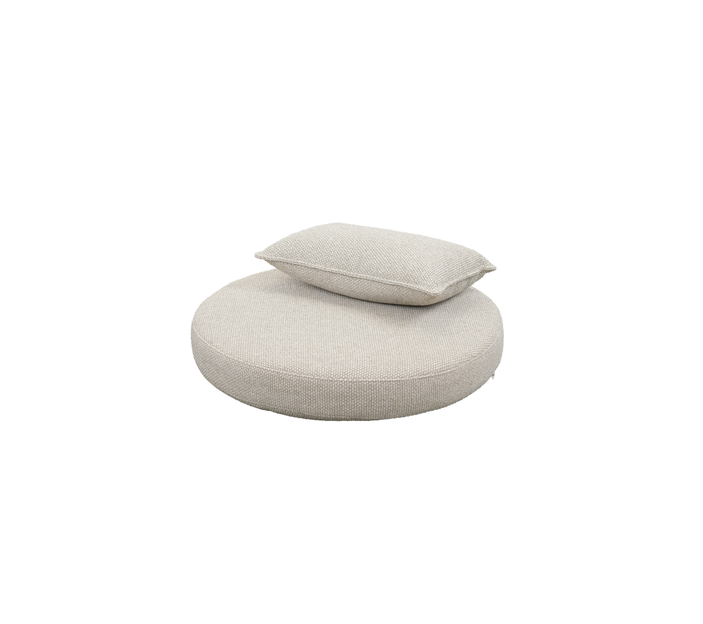 Round desert sand cushion with a smaller matching pillow.