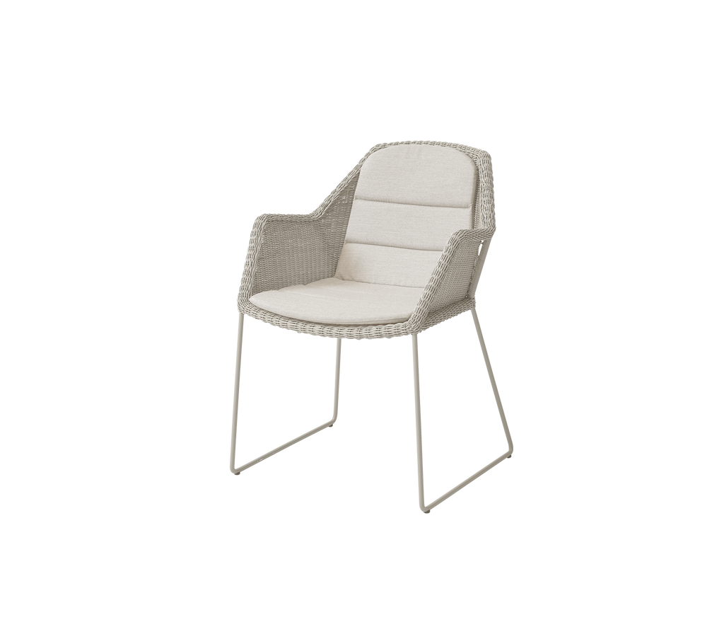 Modern beige chair with a minimalist design.