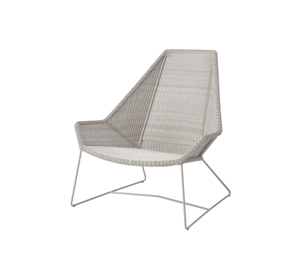 Modern chair in sand color with a unique angular design.