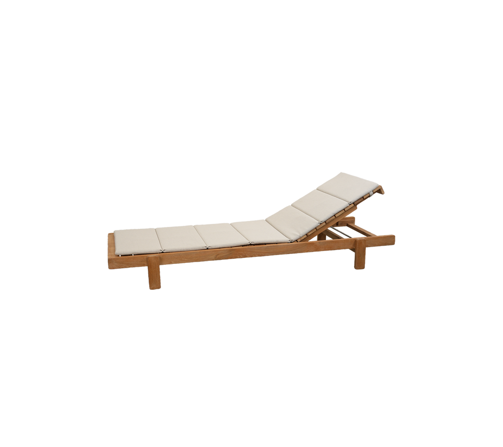 Teak lounge chair with sand cushion in a modern design.