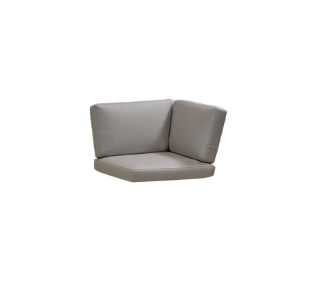 Corner seating cushion in soft gray upholstery, designed for comfort and versatile placement in various settings.