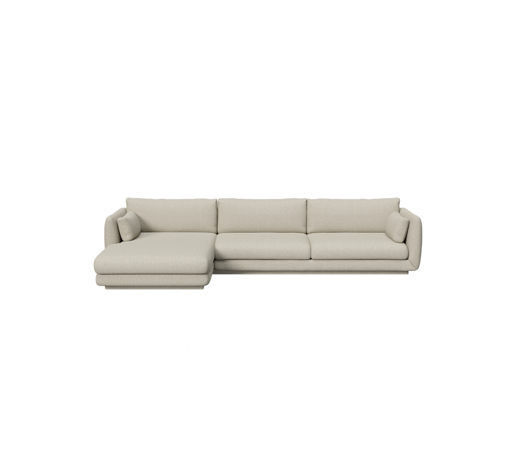 Light brown sectional sofa in a modern lounge setting.