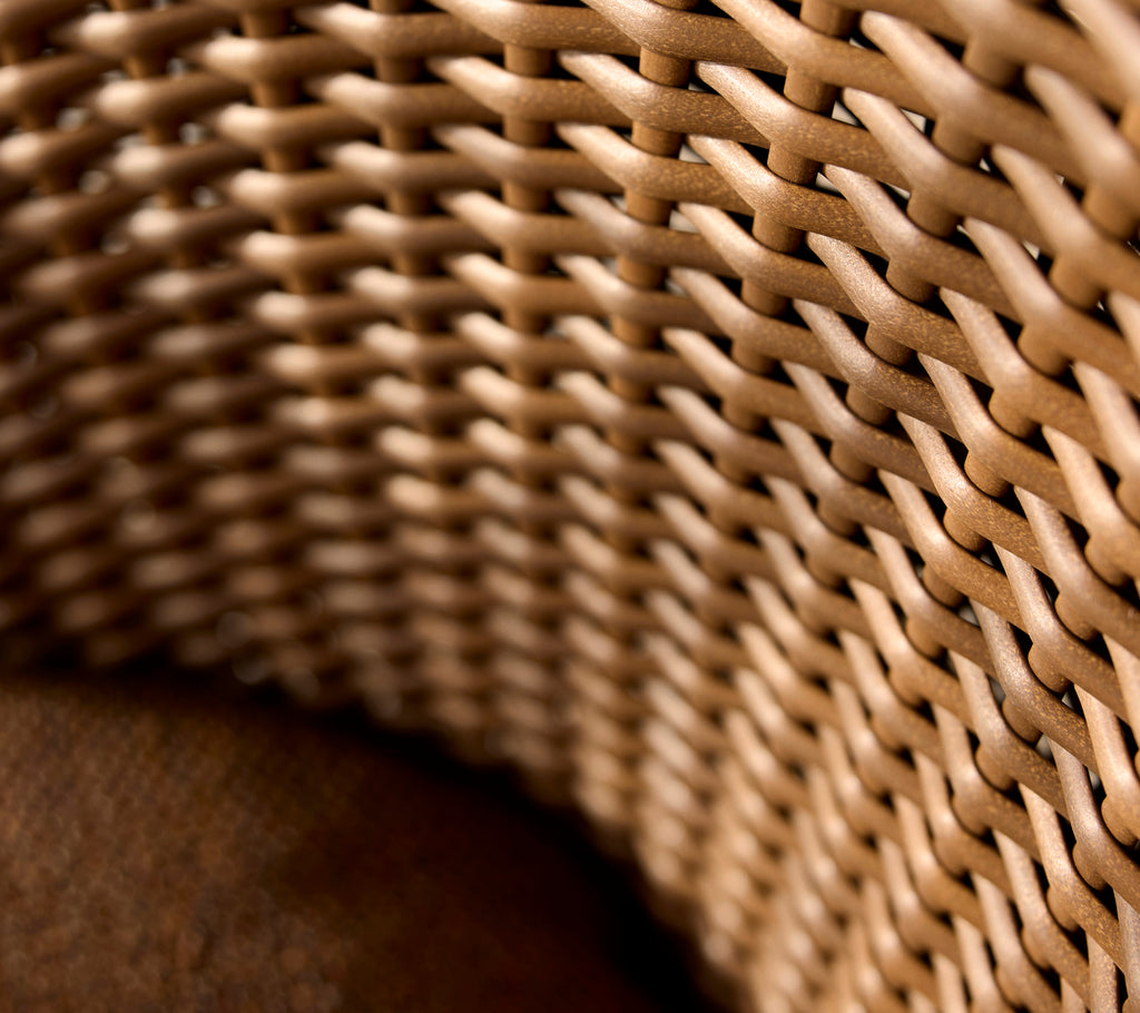 Close-up of a coast flat weave, showcasing intricate woven patterns in natural tones, emphasizing texture and craftsmanship.